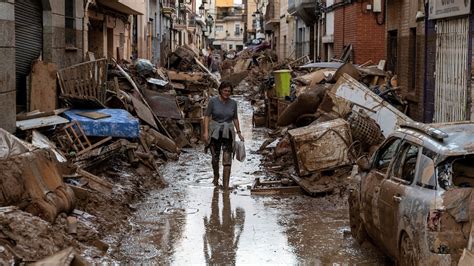 cleaning mud Spain|Spain flooding death toll climbs to 217 as .